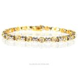 A 14 ct white and yellow gold diamond bracelet