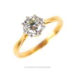 A 9 ct yellow gold and platinum, diamond solitaire ring (0.55 carats)