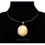 An 18 ct yellow gold, vintage, necklace with an African bone spherical pendant