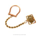 A vintage, high carat yellow gold key ring with an ancient Egyptian scarab beetle