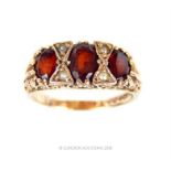 An antique, 9 ct yellow gold, garnet and seed pearl ring