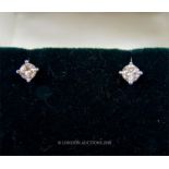 A boxed, pair of 18 ct white gold, diamond stud earrings (0.28 carats total)