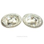 A pair of sterling silver circular bonbon dishes