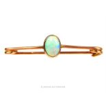 An antique, 9 ct rose gold and natural opal bar brooch