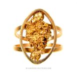 An 18 ct yellow gold ring with a natural gold ore chunk