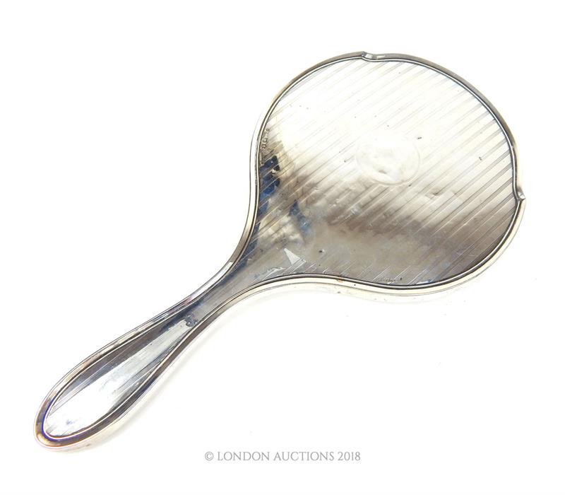 An early 20th century sterling silver hand mirror