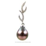 A stunning, 18 ct white gold, black Tahitian pearl and diamond-set pendant