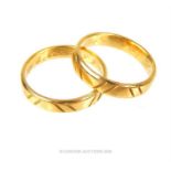 A matching pair of 18 ct yellow gold, engraved bands/rings