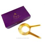 An Asprey gold plated champagne cork remover