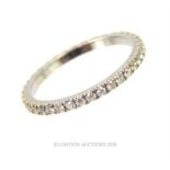 An 18 ct white gold and diamond eternity ring