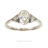 An 18 ct white gold, oval-shaped diamond ring