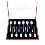 A cased set of twelve sterling silver collectors spoons