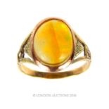 An antique, 14 ct yellow gold and fire opal cabochon ring