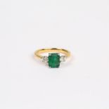 An 18 ct yellow gold, emerald and diamond ring