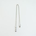 An 18 ct white gold, 3-stone, diamond, pendant and chain