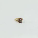 An antique, 9 ct yellow gold, garnet cabochon and pearl-studded ring