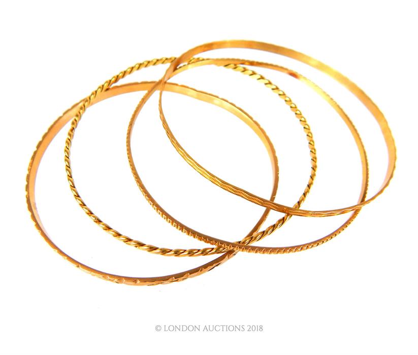 Four, 18 ct yellow gold, engraved bangles - Image 2 of 2