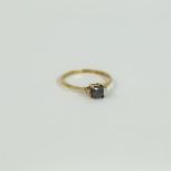 A 9 ct yellow gold, black and white diamond ring