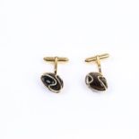 A pair of Brazilian, yellow metal and polished, chocolate-brown topaz, cuff-links