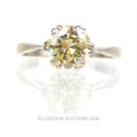 An 18 ct white gold, fancy yellow diamond, solitaire ring