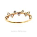 A 9 ct yellow gold, diamond-set, tendril-design ring