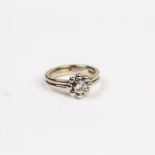 A 18 ct white gold, Tiffany & Co, diamond, flower-head ring