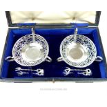 A cased pair of Edwardian sterling silver sugar bowls