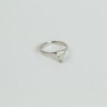 An 18 ct white gold and pear-shaped, diamond ring