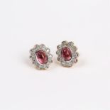 A pair of yellow gold, pink tourmaline and diamond cluster earrings