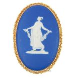 A 9 ct yellow gold and dark blue, Wedgwood jasper ware cameo brooch/pendant