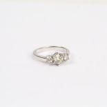 An 18 ct white gold, 3-stone, diamond ring (1.10 carats total)