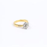 A boxed, antique, 18 ct yellow gold and seven diamond, cluster ring