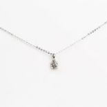 A boxed, 18 ct white gold and diamond pendant on 18 ct white gold chain (0.25 carats)