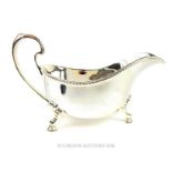 A sterling silver sauce boat