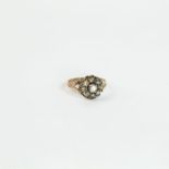 An antique, rose gold and old, rose-cut diamond cluster ring