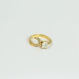 An 18 ct yellow gold, rectangular diamond and swirl ring