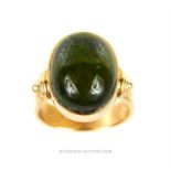 A 14 ct yellow gold, green tourmaline, cabochon ring