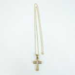 A 9 ct white and yellow gold, diamond studded cross on 9 ct chain