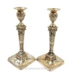A pair of Victorian Adam Revival sterling silver candlesticks, William Hutton & Sons