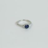 An 18 ct white gold, sapphire and diamond ring