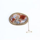 A 9 ct yellow gold brooch set with a large dendritic moss agate cabochon