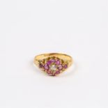 An antique, 18 ct yellow gold, ruby and diamond cluster ring