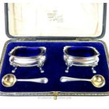 A cased pair of sterling silver salts