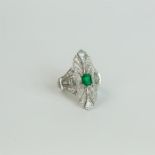 A large, 18 ct white gold, Art Deco style, diamond and emerald ring