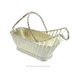 A French Christofle silver plated wine bottle basket