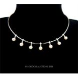 A contemporary, 18 ct white gold, diamond and pearl collar-necklace