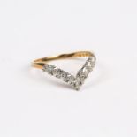 A 9 ct yellow gold and diamond, chevron-shaped ring