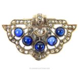 An Art Deco, white gold, diamond and sapphire cabochon, dress clip