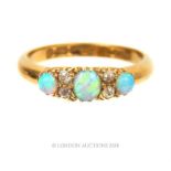 An antique, 18 ct yellow gold, 3-stone, blue opal and diamond ring