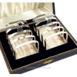 A cased pair of sterling silver Art Deco toast racks